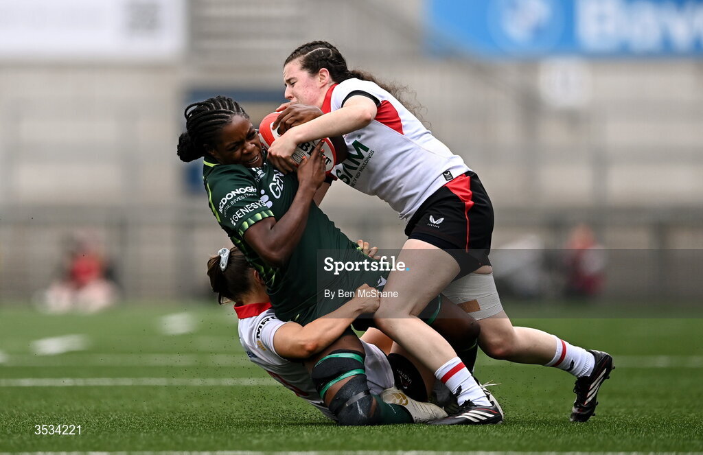 8 August 2026; Faith Oviawe of Connacht is tackled by Abby Moyles, right, and Caitlin Crowe of Ulster during the Vodafone Womens Interprovincial Championship Round 1 match between Ulster and Connacht at Affidea Stadium in Belfast. Photo by Ben McShane/Sportsfile