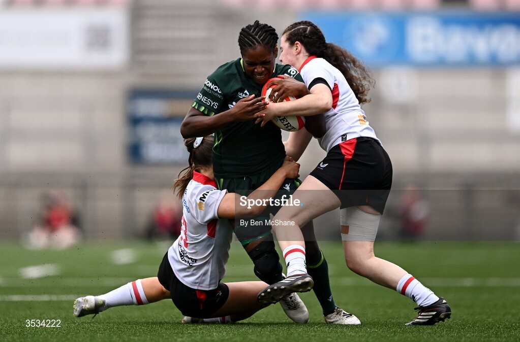 8 August 2026; Faith Oviawe of Connacht is tackled by Abby Moyles, right, and Caitlin Crowe of Ulster during the Vodafone Womens Interprovincial Championship Round 1 match between Ulster and Connacht at Affidea Stadium in Belfast. Photo by Ben McShane/Sportsfile