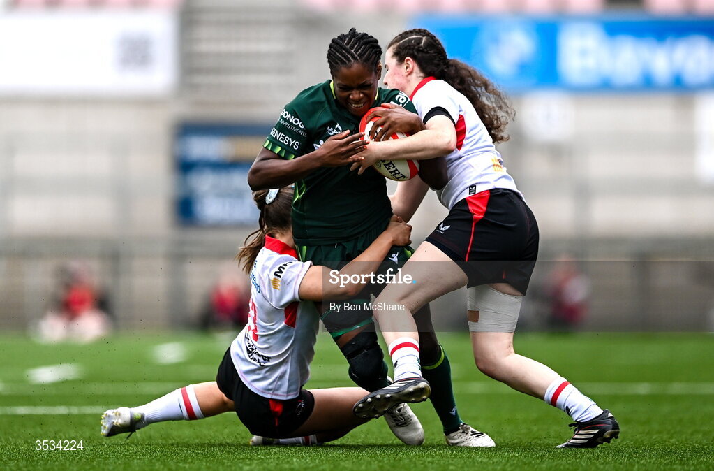 8 August 2026; Faith Oviawe of Connacht is tackled by Abby Moyles, right, and Caitlin Crowe of Ulster during the Vodafone Womens Interprovincial Championship Round 1 match between Ulster and Connacht at Affidea Stadium in Belfast. Photo by Ben McShane/Sportsfile