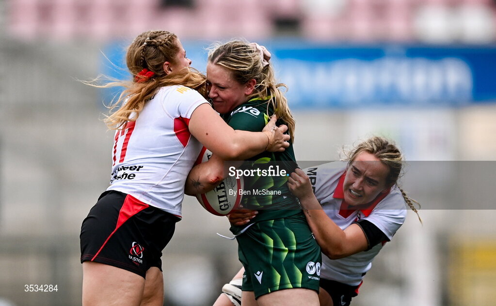 8 August 2026; Emma Kelly of Connacht is tackled by Sarah Roberts, left, and Katie Hetherington of Ulster during the Vodafone Womens Interprovincial Championship Round 1 match between Ulster and Connacht at Affidea Stadium in Belfast. Photo by Ben McShane/Sportsfile