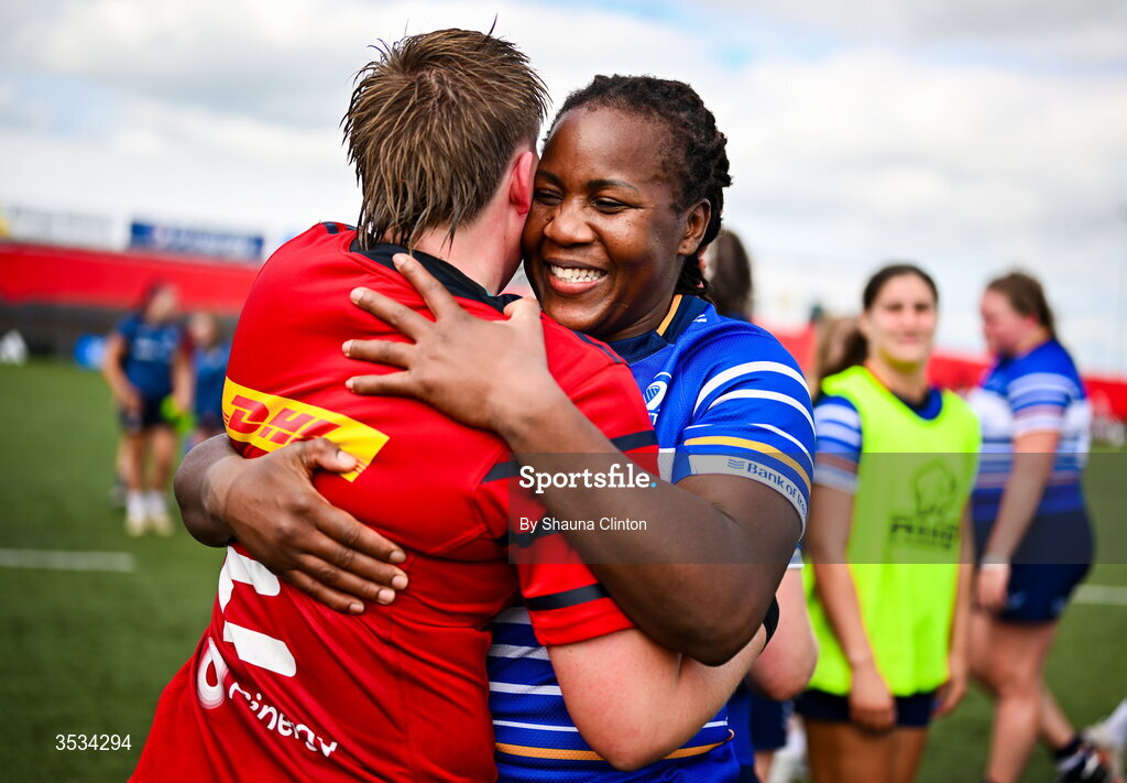 8 August 2026; Linda Djougang of Leinster hugs Beth Buttimer of Munster after the Vodafone Womens Interprovincial Championship Round 1 match between Munster and Leinster at Virgin Media Park in Cork. Photo by Shauna Clinton/Sportsfile