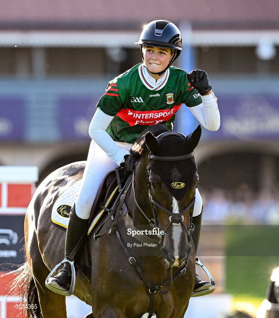 8 August 2026; Rachel Proudley, celebrates completing a jump wearing a Mayo jersey, competing on Easy Boy de Laubry Z in the Defender Puissance during day four of the Gallagher Dublin Horse Show at the RDS in Dublin. Photo by Paul Phelan/Sportsfile