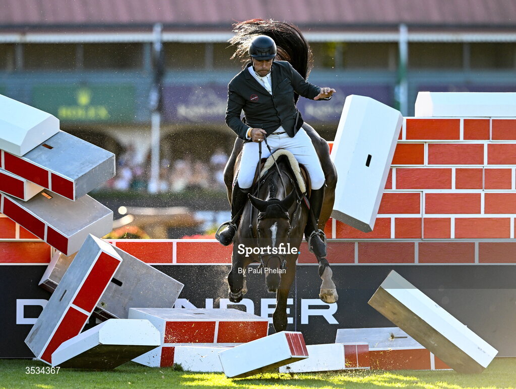 8 August 2026; Derek Mccoppin of Ireland, crashes into the wall in the last round, competing on Explosief's Legacy in the Defender Puissance during day four of the Gallagher Dublin Horse Show at the RDS in Dublin. Photo by Paul Phelan/Sportsfile