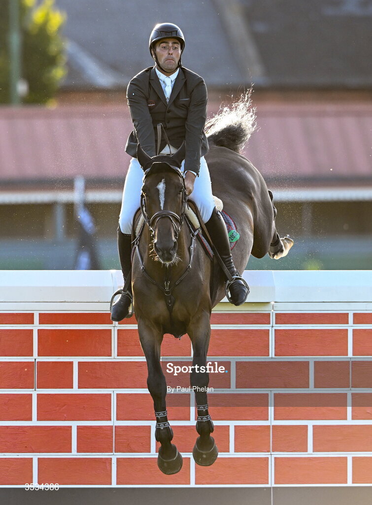 8 August 2026; Derek Mccoppin of Ireland, completes a jump, competing on Explosief's Legacy in the Defender Puissance during day four of the Gallagher Dublin Horse Show at the RDS in Dublin. Photo by Paul Phelan/Sportsfile