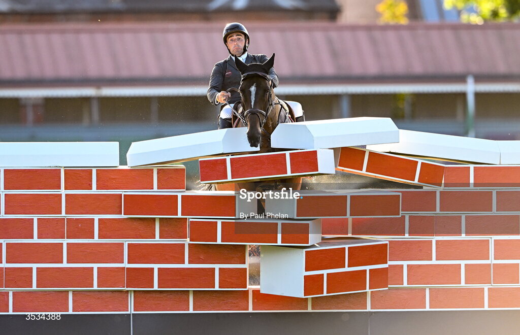 8 August 2026; Derek Mccoppin of Ireland, crashes into the wall in the last round, competing on Explosief's Legacy in the Defender Puissance during day four of the Gallagher Dublin Horse Show at the RDS in Dublin. Photo by Paul Phelan/Sportsfile