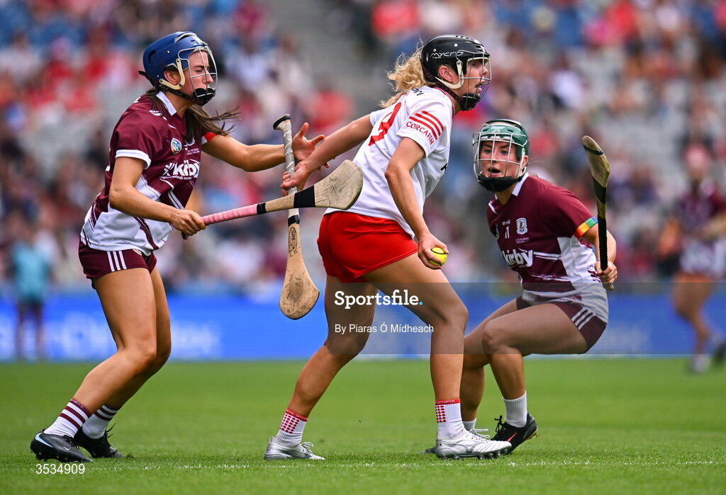 9 August 2026; Laura Hayes of Cork in action against Jennifer Hughes, left, and Niamh McPeake of Galway during the Glen Dimplex All-Ireland Senior Camogie Championship final match between Galway and Cork at Croke Park in Dublin. Photo by Piaras Ó Mídheach/Sportsfile