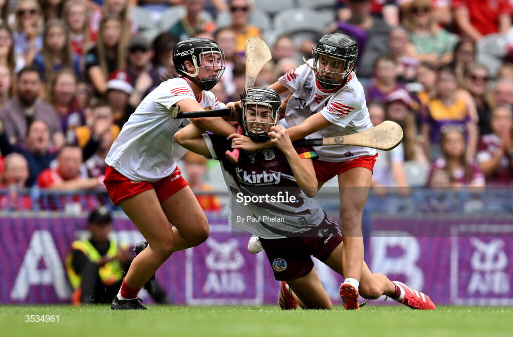 9 August 2026; Carrie Dolan of Galway is tackled by Méabh Murphy and Millie Condon of Cork during the Glen Dimplex All-Ireland Senior Camogie Championship final match between Galway and Cork at Croke Park in Dublin. Photo by Paul Phelan/Sportsfile