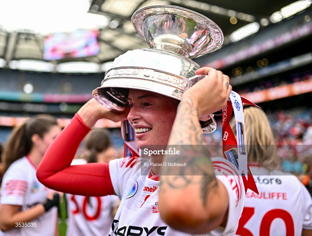 9 August 2026; Ashling Thompson of Cork celebrates with the O'Duffy Cup after her side's victory in the Glen Dimplex All-Ireland Senior Camogie Championship final match between Galway and Cork at Croke Park in Dublin. Photo by Piaras Ó Mídheach.