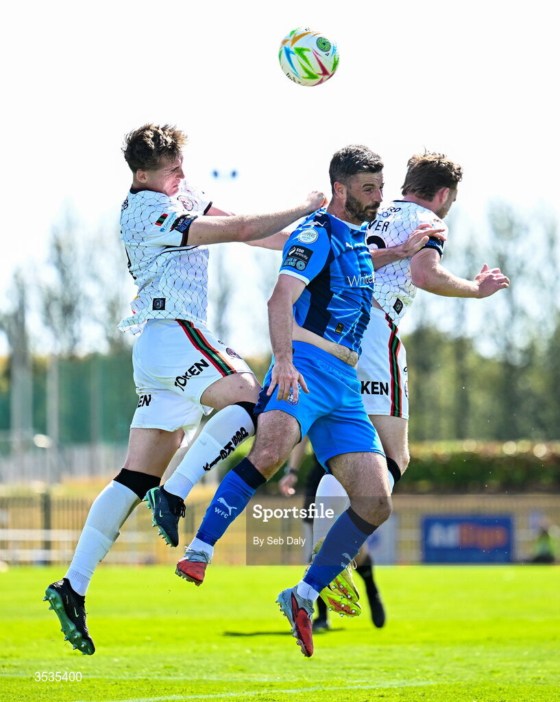 9 August 2026; Pádraig Amond of Waterford in action against Bohemians players Cian Byrne, left, and Darragh Power during the SSE Airtricity Men's Premier Division match between Waterford and Bohemians at the RSC in Waterford. Photo by Seb Daly/Sportsfile
