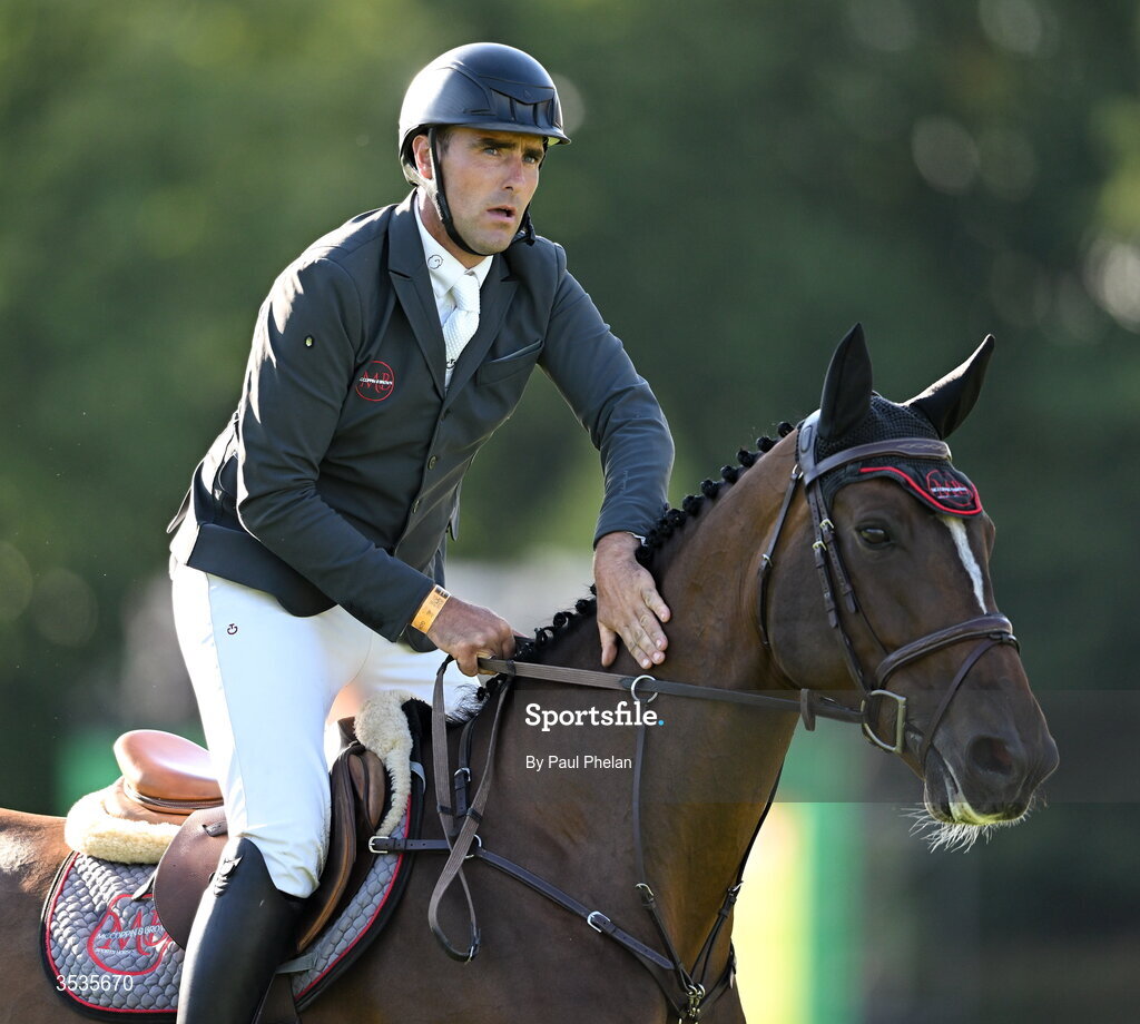 8 August 2026; Derek McCoppin of Ireland, celebrates a jump, competing on Explosief's Legacy in the Defender Puissance during day four of the Gallagher Dublin Horse Show at the RDS in Dublin. Photo by Paul Phelan/Sportsfile