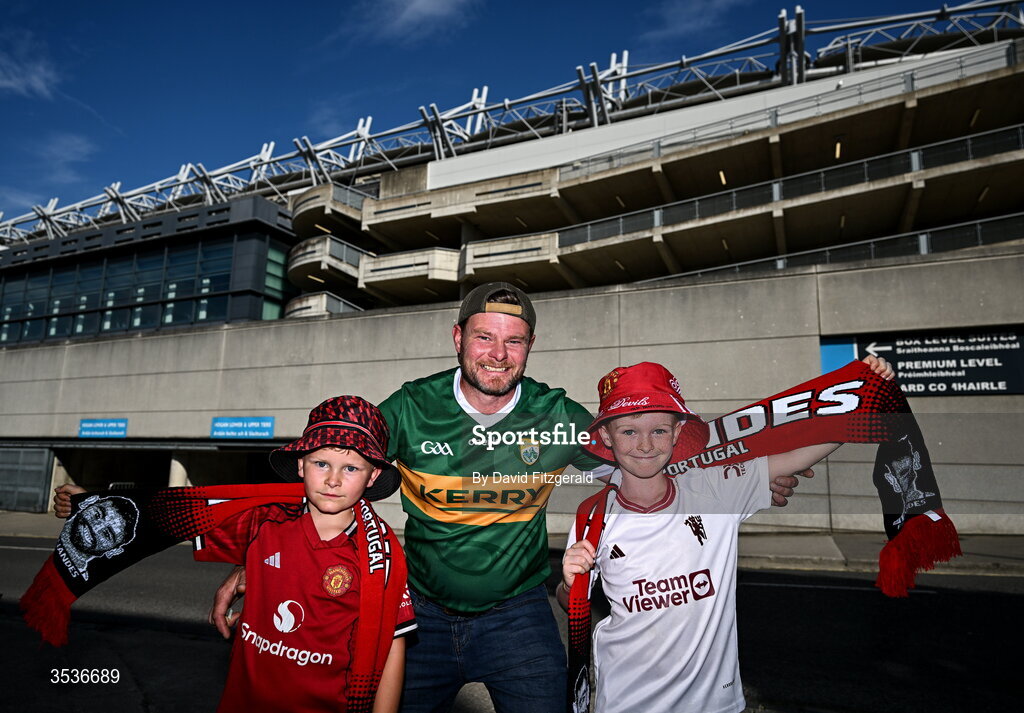 12 August 2026; Manchester United supporters Jake Schultses with his sons Freddie, age 7, left, and Hamish, age 9, from Co Kerry prior to the pre-season friendly match between Manchester United and Leeds United at Croke Park in Dublin. Photo by David Fitzgerald/Sportsfile