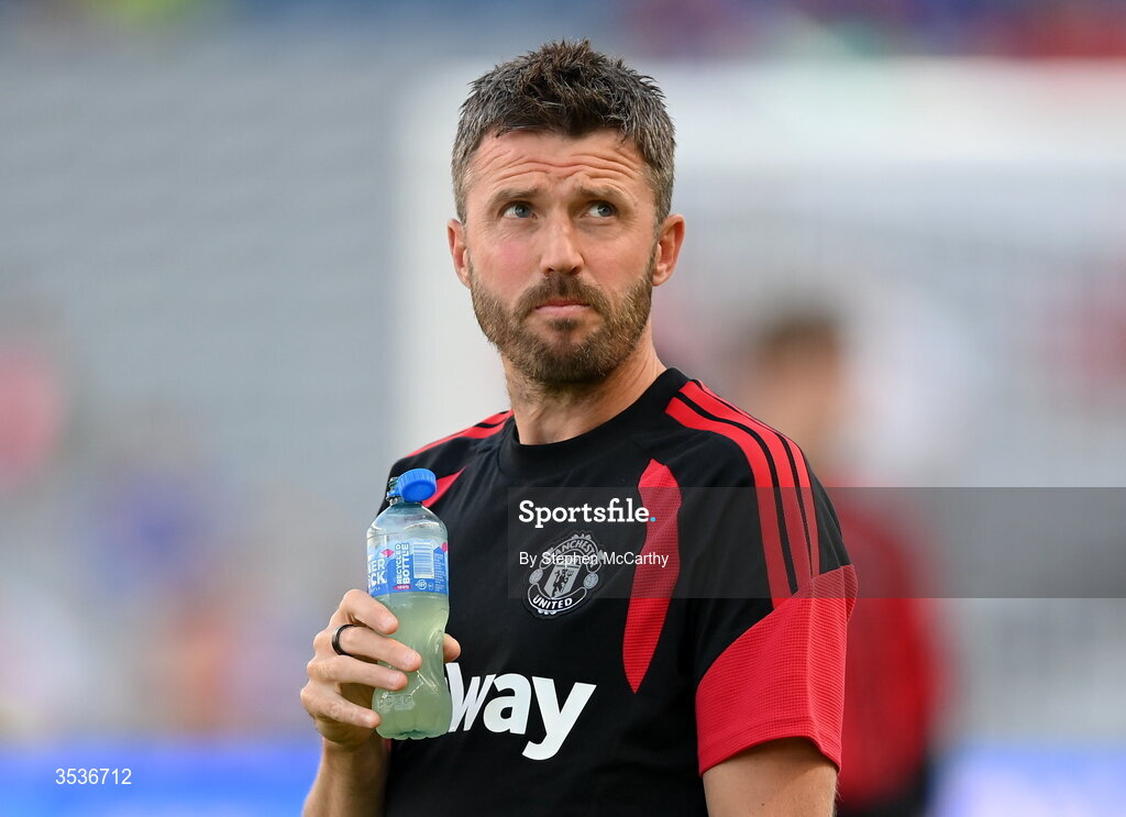 12 August 2026; Manchester United manager Michael Carrick walks the pitch before the pre-season friendly match between Manchester United and Leeds United at Croke Park in Dublin. Photo by Stephen McCarthy/Sportsfile
