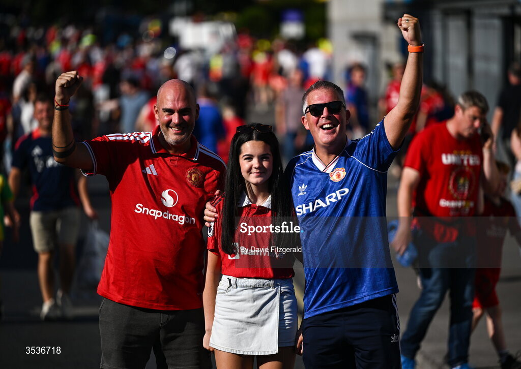 12 August 2026; Manchester United supporters Darran, Caoimhe and Gareth McConville from Armagh prior to the pre-season friendly match between Manchester United and Leeds United at Croke Park in Dublin. Photo by David Fitzgerald/Sportsfile