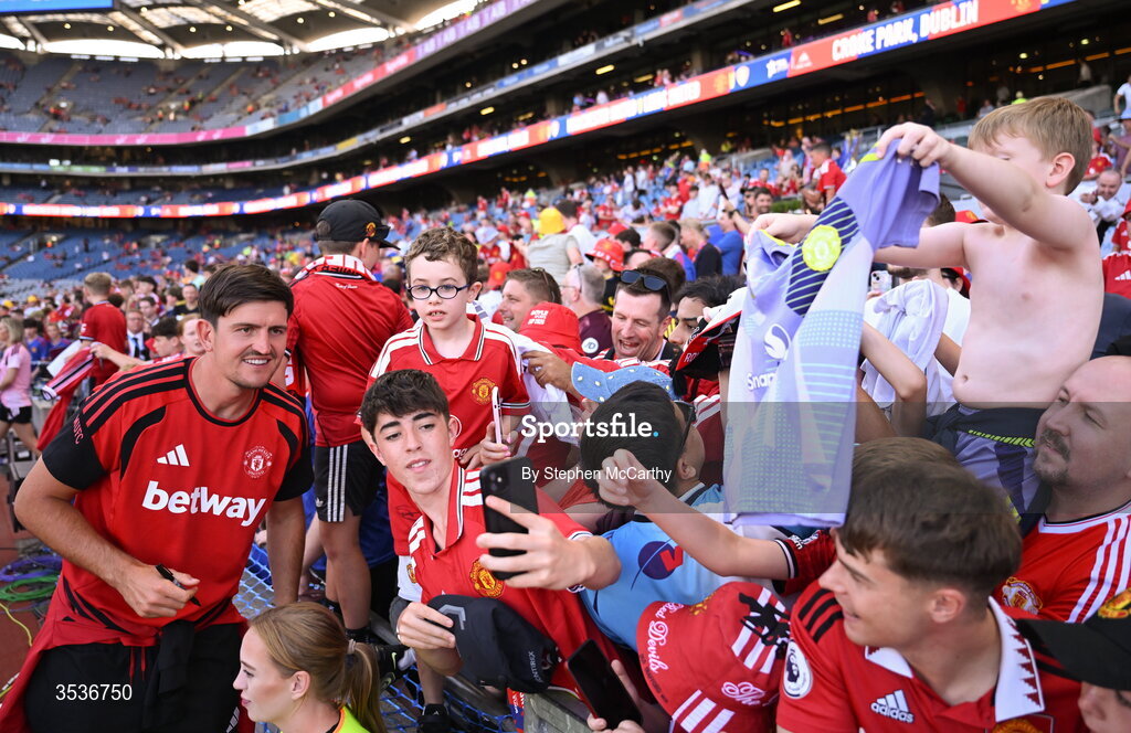 12 August 2026; Harry Maguire of Manchester United takes pictures with Manchester United supporters before the pre-season friendly match between Manchester United and Leeds United at Croke Park in Dublin. Photo by Stephen McCarthy/Sportsfile