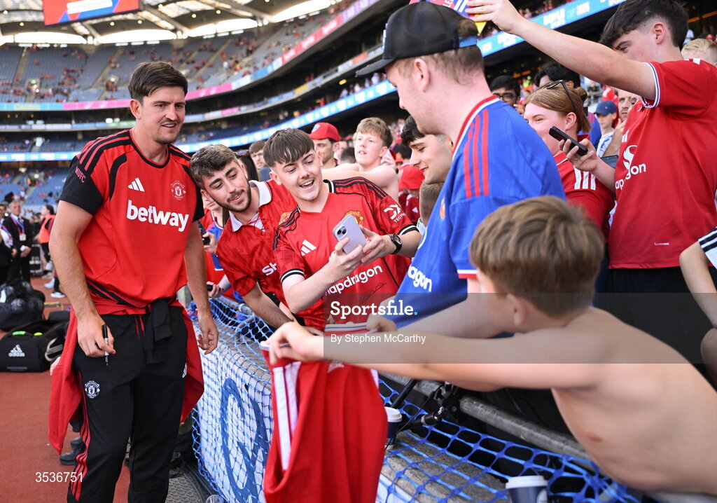 12 August 2026; Harry Maguire of Manchester United takes pictures with supporters before the pre-season friendly match between Manchester United and Leeds United at Croke Park in Dublin. Photo by Stephen McCarthy/Sportsfile