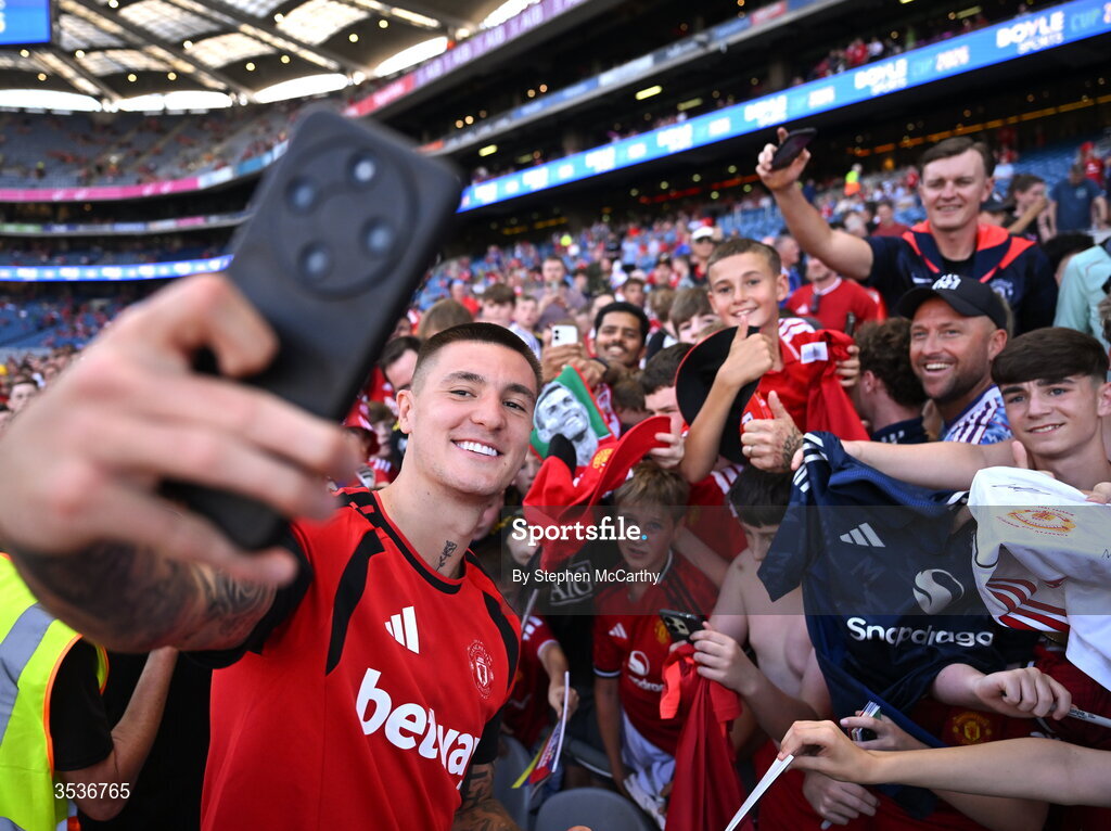 12 August 2026; Benjamin Šeško of Manchester United takes a selfie with supporters before the pre-season friendly match between Manchester United and Leeds United at Croke Park in Dublin. Photo by Stephen McCarthy/Sportsfile