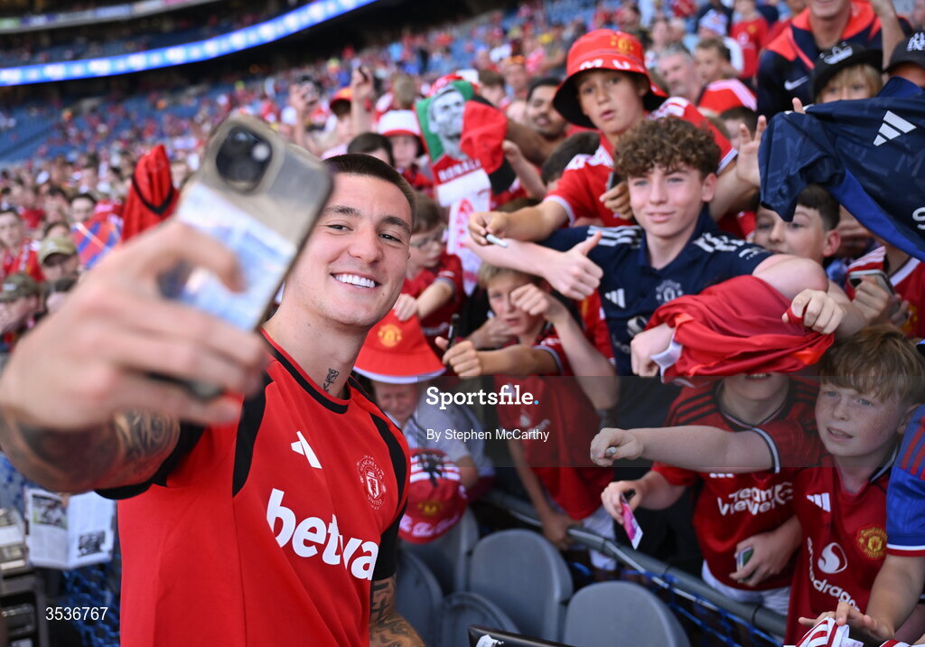 12 August 2026; Benjamin Šeško of Manchester United takes a selfie with supporters before the pre-season friendly match between Manchester United and Leeds United at Croke Park in Dublin. Photo by Stephen McCarthy/Sportsfile