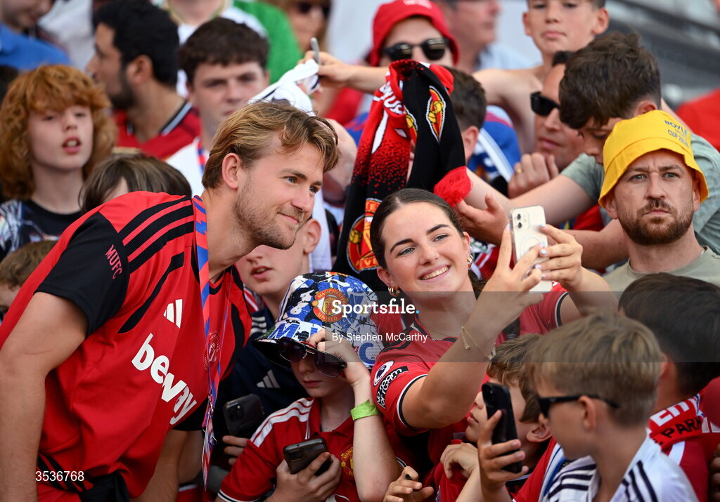 12 August 2026; Matthijs de Ligt of Manchester United takes pictures with supporters before the pre-season friendly match between Manchester United and Leeds United at Croke Park in Dublin. Photo by Stephen McCarthy/Sportsfile