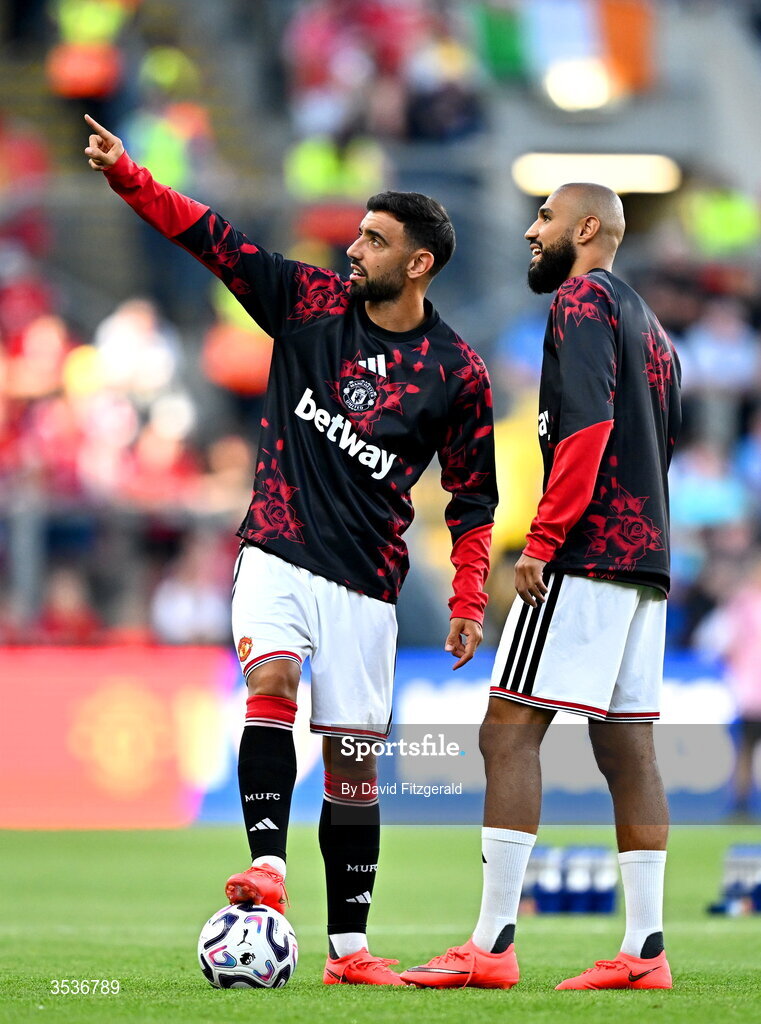 12 August 2026; Bruno Fernandes, left, and Noussair Mazraoui of Manchester United during the pre-season friendly match between Manchester United and Leeds United at Croke Park in Dublin. Photo by David Fitzgerald/Sportsfile