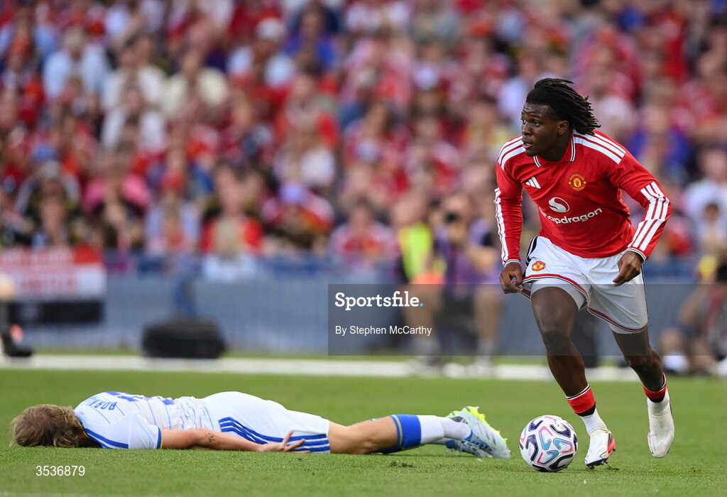 12 August 2026; Patrick Dorgu of Manchester United in action against Sabastiaan Bornauw of Leeds United during the pre-season friendly match between Manchester United and Leeds United at Croke Park in Dublin. Photo by Stephen McCarthy/Sportsfile