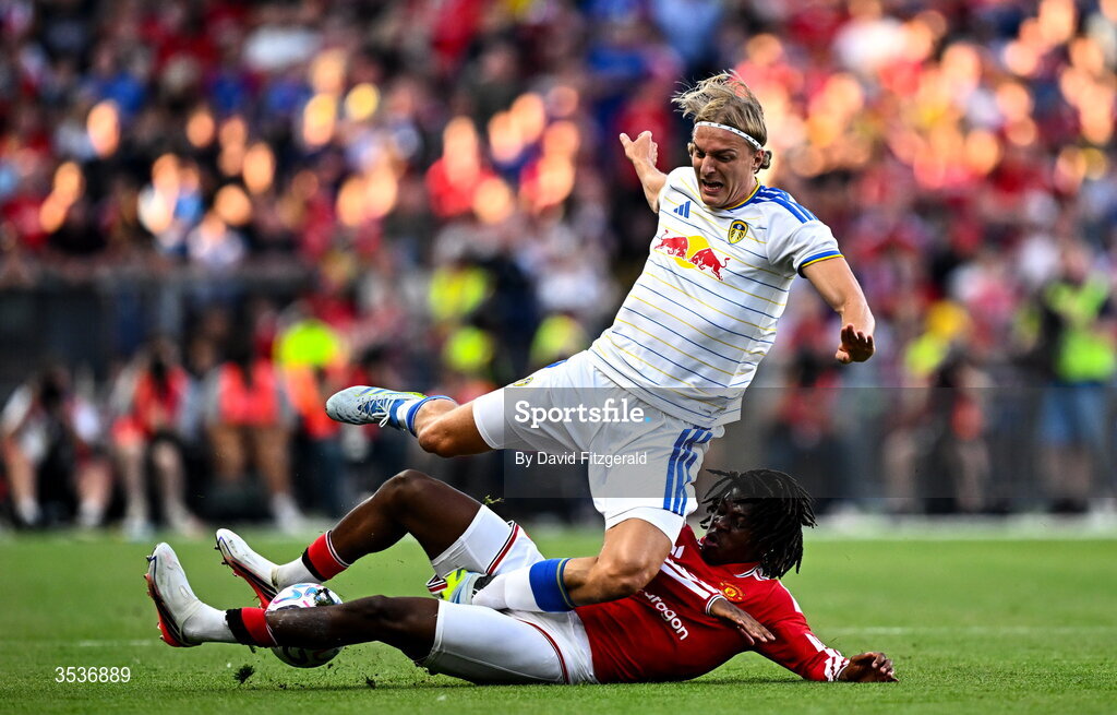 12 August 2026; Sabastiaan Bornauw of Leeds United is tackled by Patrick Dorgu of Manchester United during the pre-season friendly match between Manchester United and Leeds United at Croke Park in Dublin. Photo by David Fitzgerald/Sportsfile
