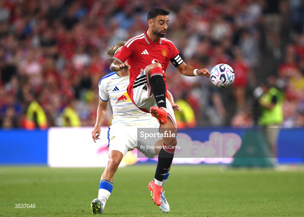 12 August 2026; Bruno Fernandes of Manchester United in action against Sabastiaan Bornauw of Leeds United during the pre-season friendly match between Manchester United and Leeds United at Croke Park in Dublin. Photo by Stephen McCarthy/Sportsfile