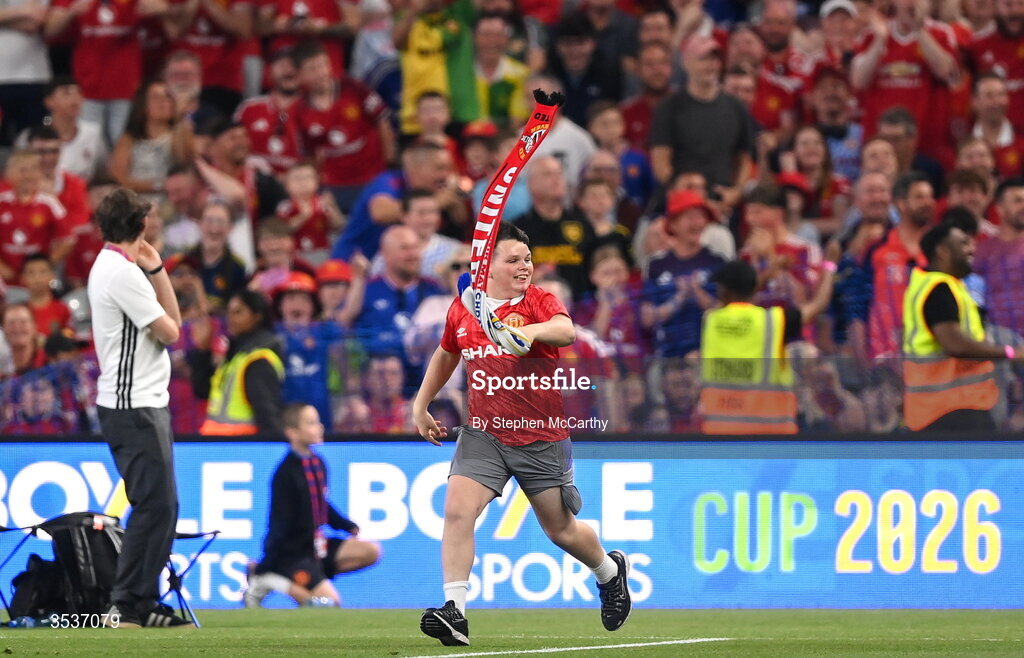 12 August 2026; A supporter runs onto the pitch during the pre-season friendly match between Manchester United and Leeds United at Croke Park in Dublin. Photo by Stephen McCarthy/Sportsfile