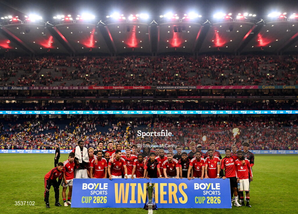 12 August 2026; Manchester United players celebrate with the trophy after their side's victory in the pre-season friendly match between Manchester United and Leeds United at Croke Park in Dublin. Photo by Stephen McCarthy/Sportsfile