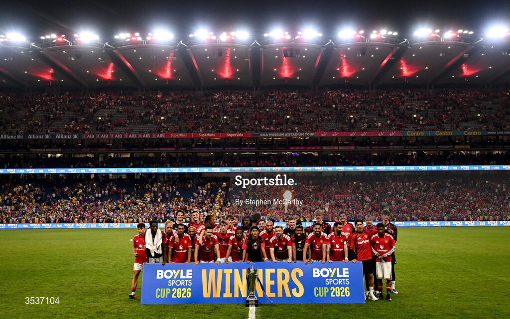 12 August 2026; Manchester United players celebrate with the trophy after their side's victory in the pre-season friendly match between Manchester United and Leeds United at Croke Park in Dublin. Photo by Stephen McCarthy/Sportsfile
