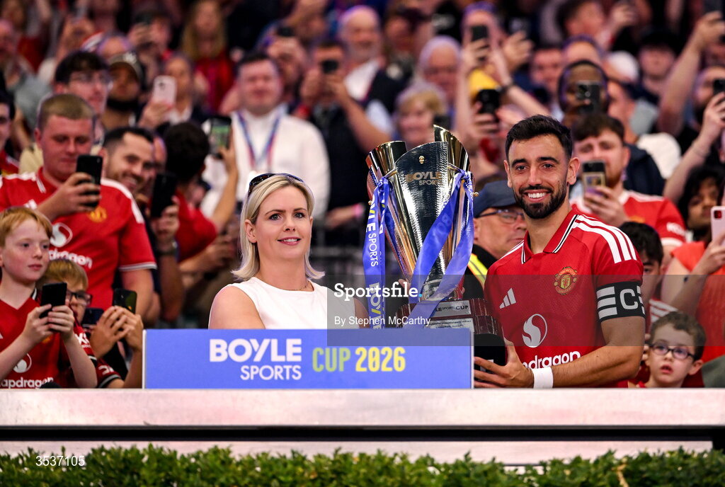 12 August 2026; Bruno Fernandes of Manchester United is presented the BOYLE Sports Cup, by Jenna Boyle, President of BOYLE Sports, after his side's victory in the pre-season friendly match between Manchester United and Leeds United at Croke Park in Dublin. Photo by Stephen McCarthy/Sportsfile