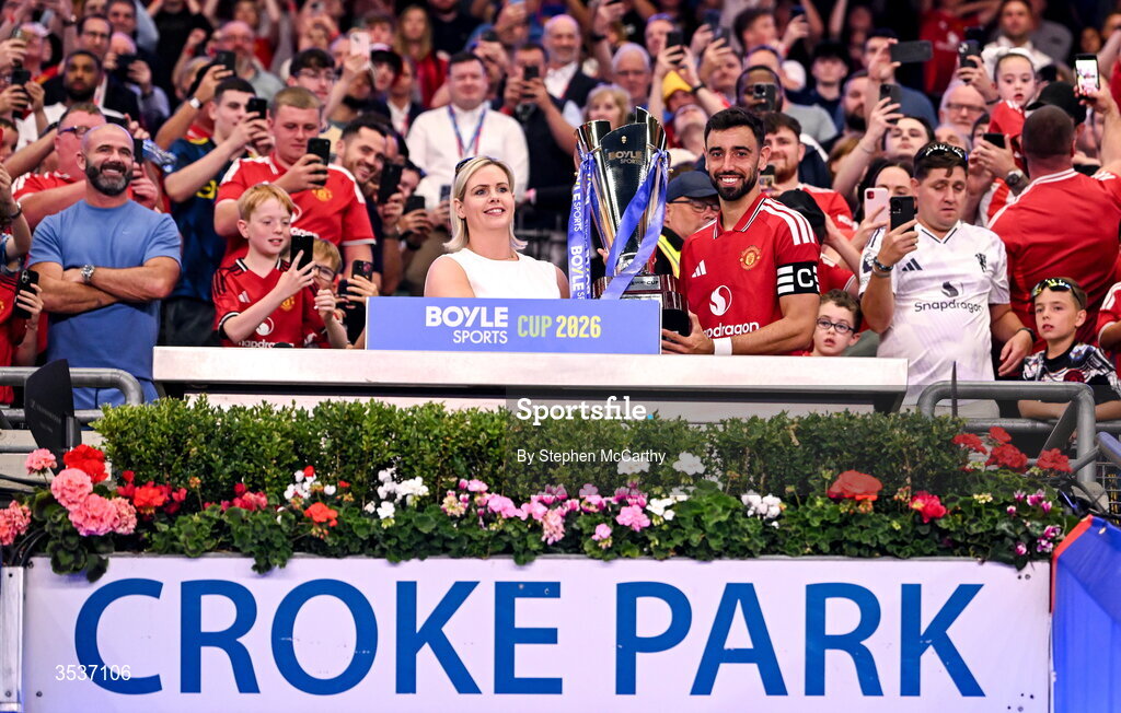 12 August 2026; Bruno Fernandes of Manchester United is presented the BOYLE Sports Cup by Jenna Boyle, President of BOYLE Sports, after his side's victory in the pre-season friendly match between Manchester United and Leeds United at Croke Park in Dublin. Photo by Stephen McCarthy/Sportsfile