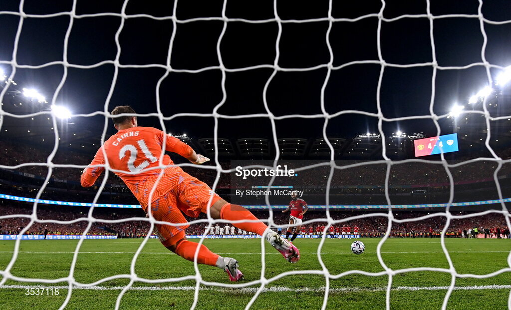 12 August 2026; Noussair Mazraoui of Manchester United shoots to score the winning penalty in the penalty shootout during the pre-season friendly match between Manchester United and Leeds United at Croke Park in Dublin. Photo by Stephen McCarthy/Sportsfile