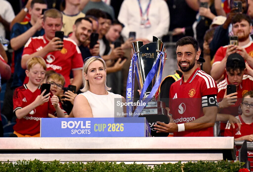 12 August 2026; Bruno Fernandes of Manchester United is presented the BOYLE Sports Cup by Jenna Boyle, President of BOYLE Sports, after his side's victory in the pre-season friendly match between Manchester United and Leeds United at Croke Park in Dublin. Photo by Ben McShane/Sportsfile