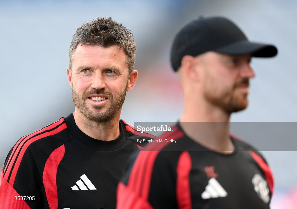 12 August 2026; Manchester United manager Michael Carrick and assistant manager Jonny Evans, right, before the pre-season friendly match between Manchester United and Leeds United at Croke Park in Dublin. Photo by Stephen McCarthy/Sportsfile