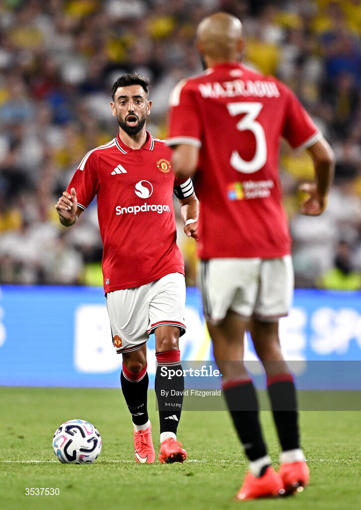 12 August 2026; Bruno Fernandes of Manchester United, left, and Noussair Mazraoui during the pre-season friendly match between Manchester United and Leeds United at Croke Park in Dublin. Photo by David Fitzgerald/Sportsfile