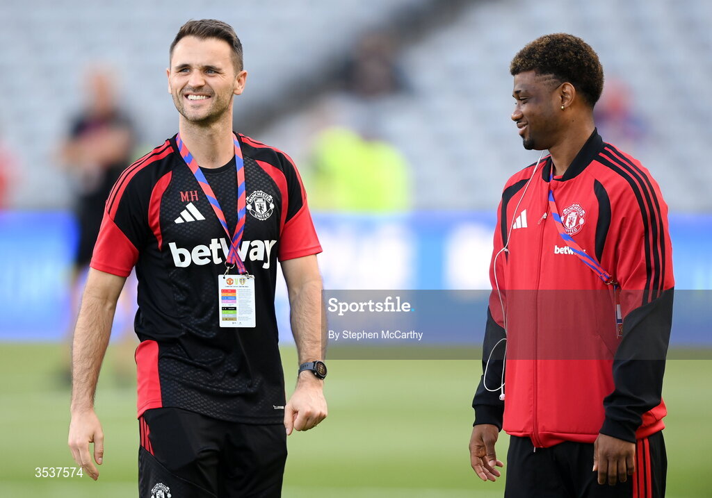 12 August 2026; Manchester United nutritionist Marcus Hannon, left, with Amad Diallo of Manchester United before the pre-season friendly match between Manchester United and Leeds United at Croke Park in Dublin.