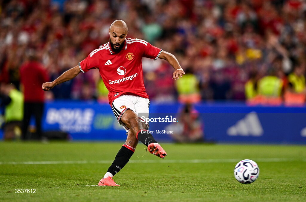 12 August 2026; Noussair Mazraoui of Manchester United scores his side's winning penalty in the penalty shootout during the pre-season friendly match between Manchester United and Leeds United at Croke Park in Dublin. Photo by Ben McShane/Sportsfile