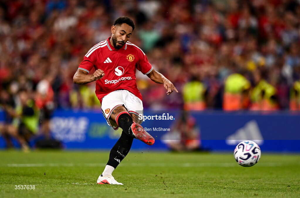 12 August 2026; Matheus Cunha of Manchester United takes a penalty in the penalty shootout during the pre-season friendly match between Manchester United and Leeds United at Croke Park in Dublin. Photo by Ben McShane/Sportsfile