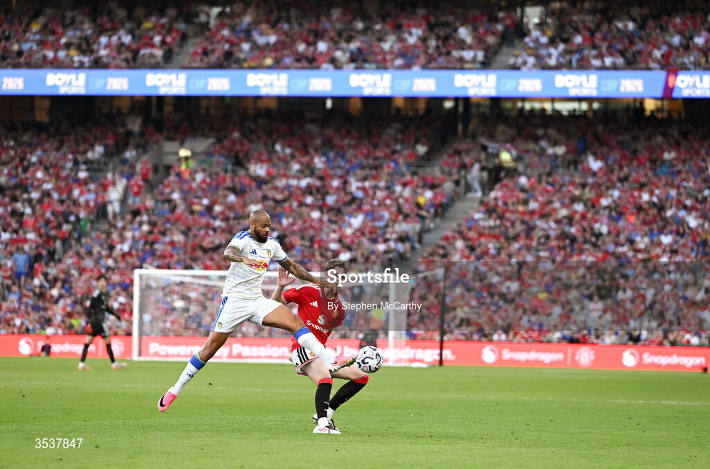 12 August 2026; Tyler Fletcher of Manchester United is challenged by Lukas Nmecha of Leeds United  during the pre-season friendly match between Manchester United and Leeds United at Croke Park in Dublin. Photo by Stephen McCarthy/Sportsfile