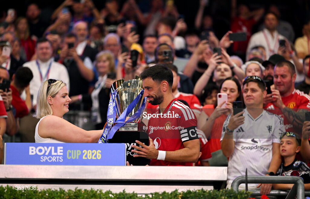 12 August 2026; Jenna Boyle, President of BOYLE Sports, presents Bruno Fernandes of Manchester United with the BOYLE Sports cup after the pre-season friendly match between Manchester United and Leeds United at Croke Park in Dublin. Photo by Stephen McCarthy/Sportsfile