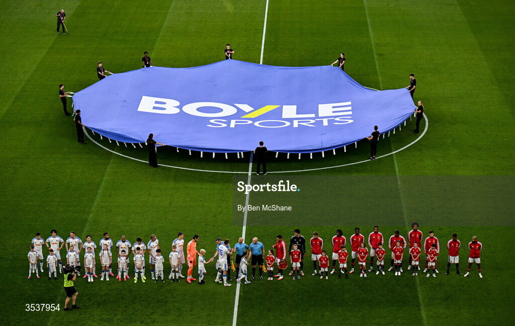 12 August 2026; Players of both sides and officials line up before the pre-season friendly match between Manchester United and Leeds United at Croke Park in Dublin. Photo by Ben McShane/Sportsfile