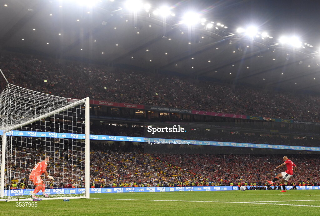 12 August 2026; Noussair Mazraoui of Manchester United scores past Leeds United goalkeeper Alex Cairns during a penalty shootout at the end of the pre-season friendly match between Manchester United and Leeds United at Croke Park in Dublin. Photo by Stephen McCarthy/Sportsfile