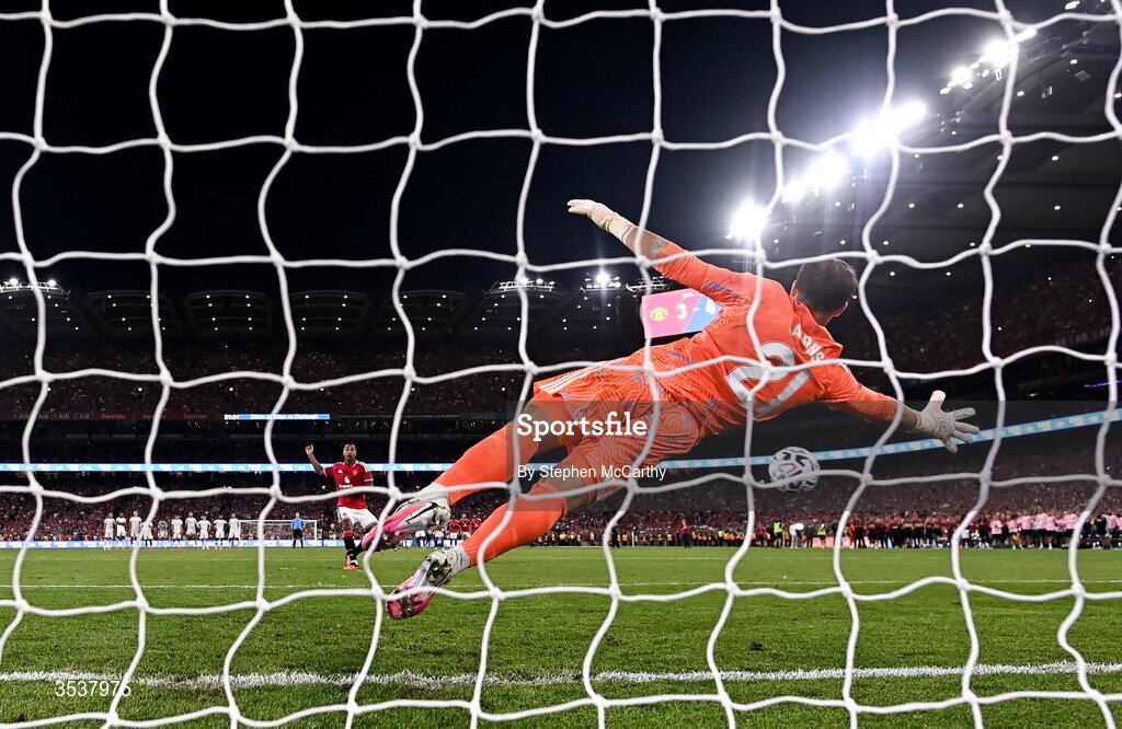12 August 2026; Youri Tielemans of Manchester United scores a penalty past Leeds United goalkeeper Alex Cairns during a penalty shootout at the end of the pre-season friendly match between Manchester United and Leeds United at Croke Park in Dublin. Photo by Stephen McCarthy/Sportsfile
