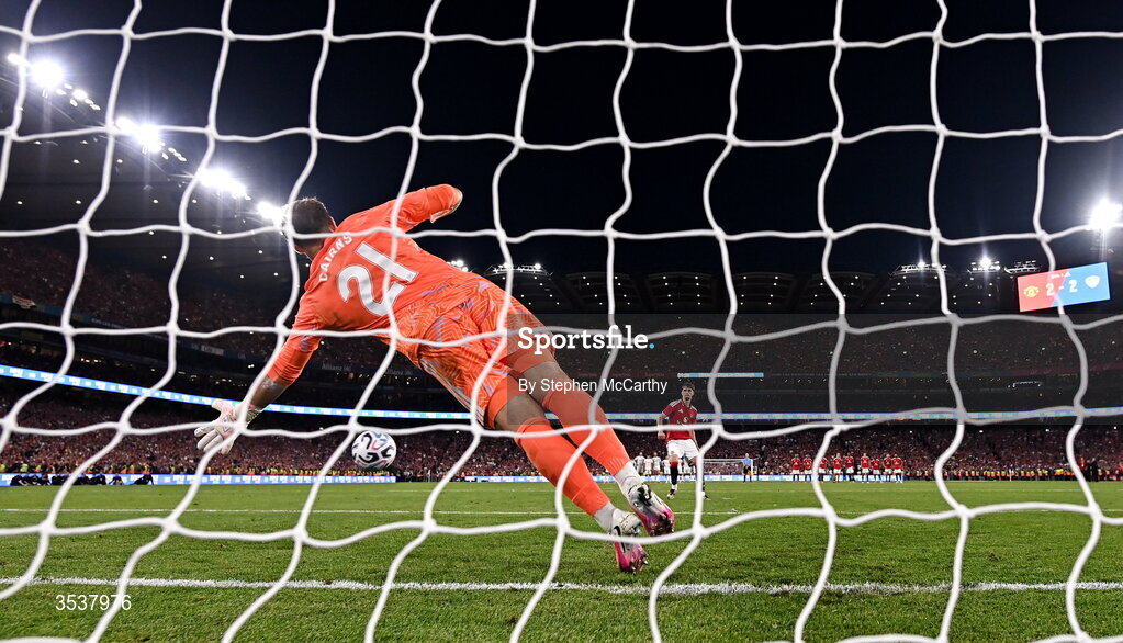 12 August 2026; Jack Fletcher of Manchester United scores his penalty past Leeds United goalkeeper Alex Cairns during a penalty shootout at the end of the pre-season friendly match between Manchester United and Leeds United at Croke Park in Dublin. Photo by Stephen McCarthy/Sportsfile