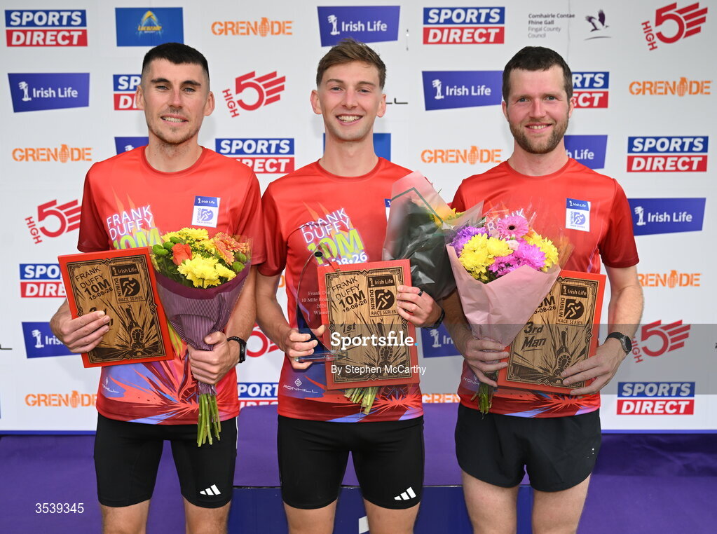 15 August 2026; The men's podium, from left, second placed Michael Brady of Raheny Shamrock AC, winner Cormac Dalton of Mullingar Harriers AC and third place Neil Johnston of Annadale Striders after the 2026 Irish Life Frank Duffy 10 Mile, in the Phoenix Park, Dublin. Thousands of runners took part in the sold out Irish Life Frank Duffy 10 Mile, the second event in the 2026 Irish Life Dublin Race Series. Photo by Stephen McCarthy/Sportsfile