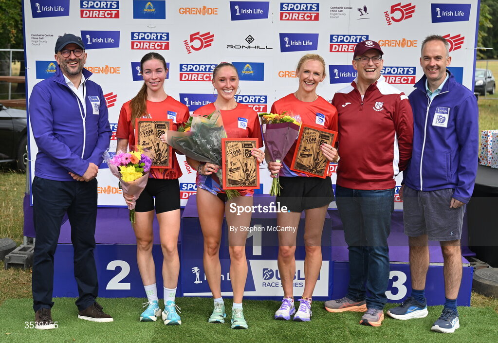 15 August 2026; Brendan McEvoy, chief customer marketing society and innovation officer, Irish Life, left, Barry Ryan, Civil Service Harriers AC, second from right, and Oisin O’Shaughnessy managing director employer solutions, Irish Life, with women's podium finishers, from left, second placed Sarah Diamond of Kilcoole AC, winner Maebh Brannigan of Galway City Harriers AC and third placed Pamela Kirk of RaodRunners AC during the 2026 Irish Life Frank Duffy 10 Mile, in the Phoenix Park, Dublin. Thousands of runners took part in the sold out Irish Life Frank Duffy 10 Mile, the second event in the 2026 Irish Life Dublin Race Series. Photo by Stephen McCarthy/Sportsfile