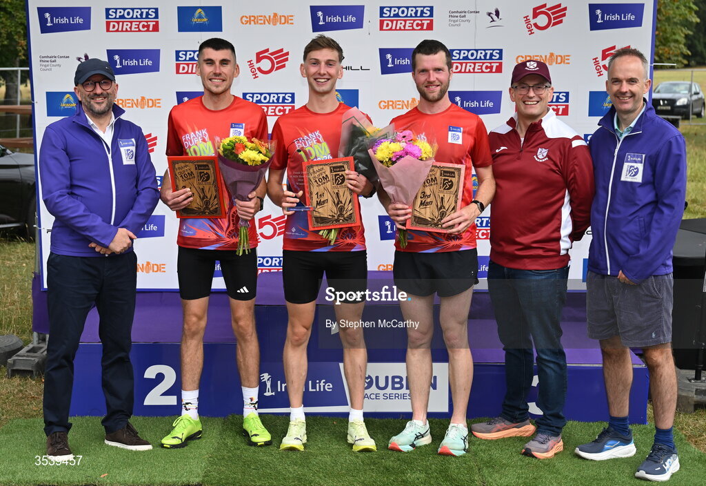 15 August 2026; Brendan McEvoy, chief customer marketing society and innovation officer, Irish Life, left, Barry Ryan, Civil Service Harriers AC, second from right, and Oisin O’Shaughnessy managing director employer solutions, Irish Life, with men's podium finishers, from left, second placed Michael Brady of Raheny Shamrock AC, winner Cormac Dalton of Mullingar Harriers AC and third placed Neil Johnston of Annadale Striders during the 2026 Irish Life Frank Duffy 10 Mile, in the Phoenix Park, Dublin. Thousands of runners took part in the sold out Irish Life Frank Duffy 10 Mile, the second event in the 2026 Irish Life Dublin Race Series. Photo by Stephen McCarthy/Sportsfile