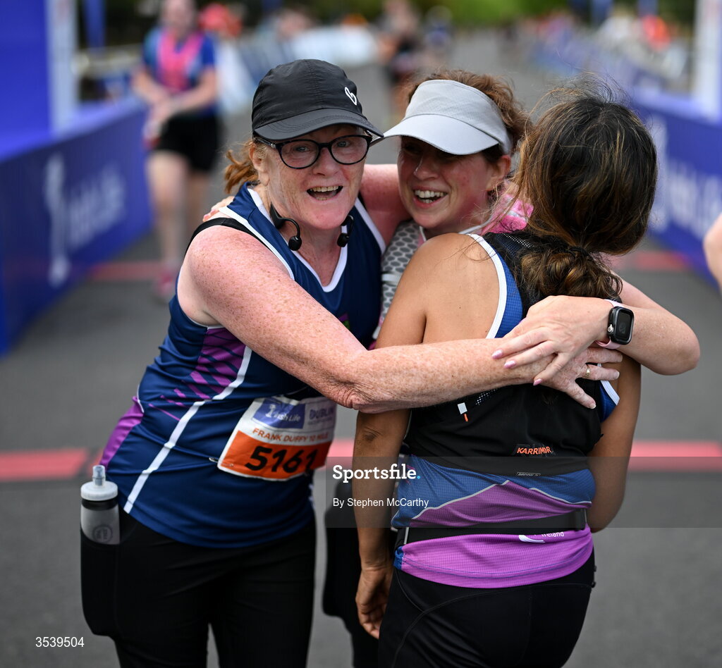 15 August 2026; Athletes from Croghan AC in Wexford, from left, Pamela Fitzpatrick, Antoinette McGough and Fiona McCooey embrace following the 2026 Irish Life Frank Duffy 10 Mile, in the Phoenix Park, Dublin. Thousands of runners took part in the sold out Irish Life Frank Duffy 10 Mile, the second event in the 2026 Irish Life Dublin Race Series. Photo by Stephen McCarthy/Sportsfile