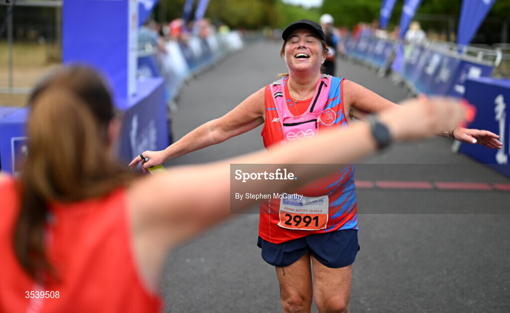 15 August 2026; Athletes from Artane/Beaumont Running Club AC embrace after finishing the 2026 Irish Life Frank Duffy 10 Mile, in the Phoenix Park, Dublin. Thousands of runners took part in the sold out Irish Life Frank Duffy 10 Mile, the second event in the 2026 Irish Life Dublin Race Series. Photo by Stephen McCarthy/Sportsfile