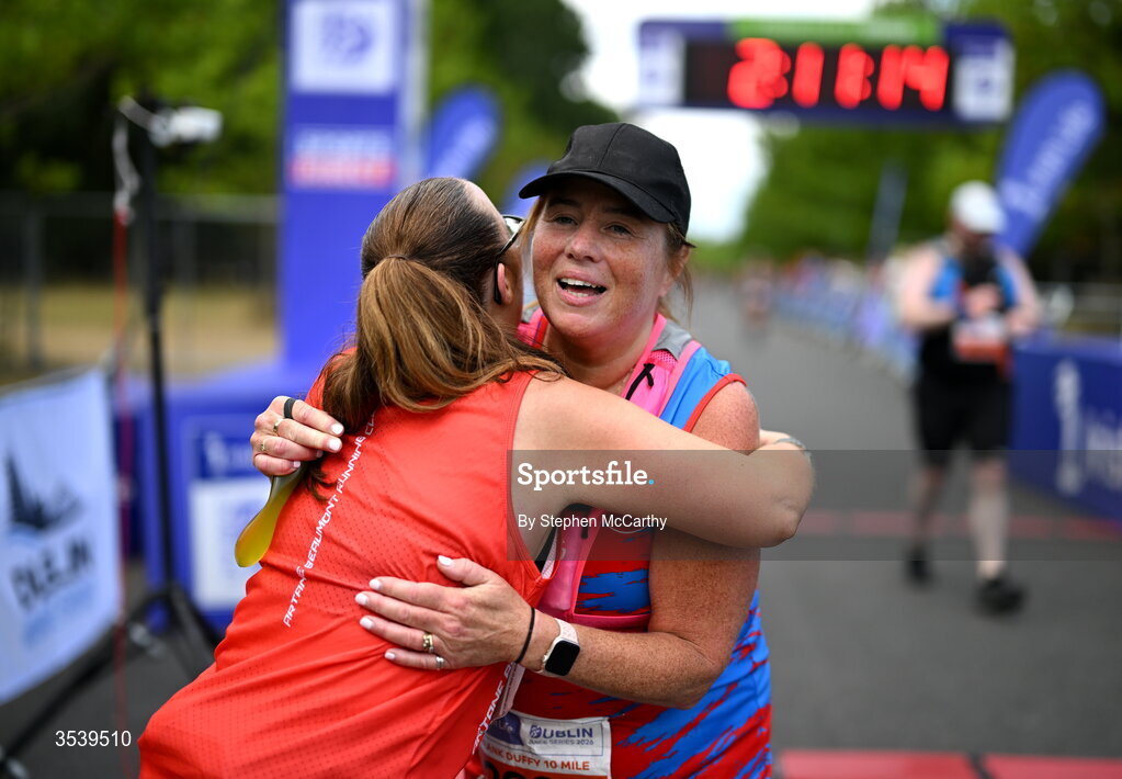 15 August 2026; Athletes from Artane/Beaumont Running Club AC embrace after finishing the 2026 Irish Life Frank Duffy 10 Mile, in the Phoenix Park, Dublin. Thousands of runners took part in the sold out Irish Life Frank Duffy 10 Mile, the second event in the 2026 Irish Life Dublin Race Series. Photo by Stephen McCarthy/Sportsfile
